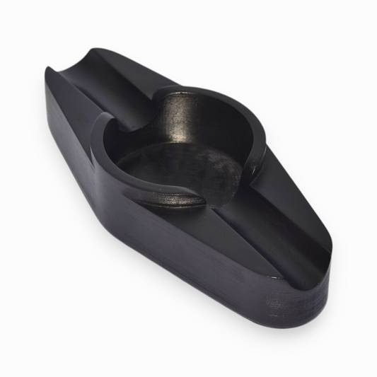A cigar ashtray with two cigar rests and a round ash hole (black)