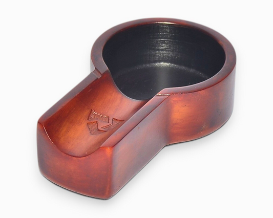 Wooden ring holder with a black interior on a white background