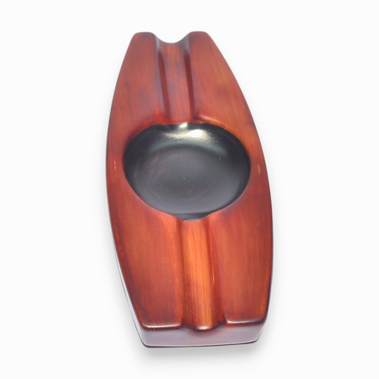 Wooden ashtray with a metallic interior on a white background