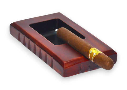 Cigar in a wooden humidor on a white background