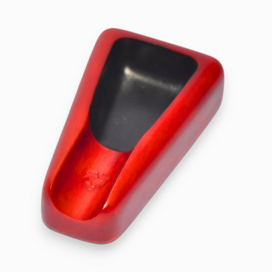Red and black ashtray cover on a white background
