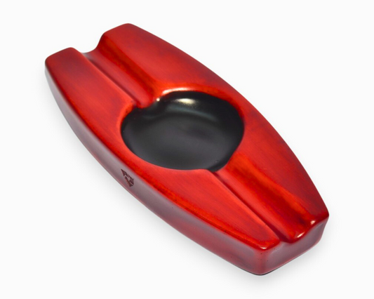 Red and black cigar ashtray on a white background