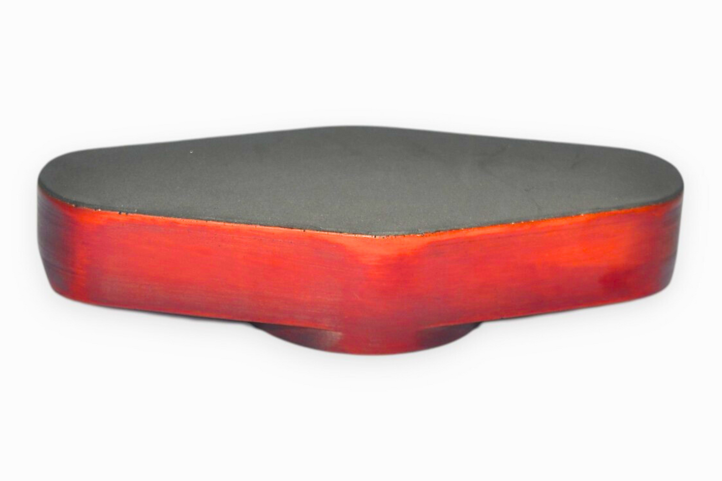 Triangular red and black ashtray on a white background