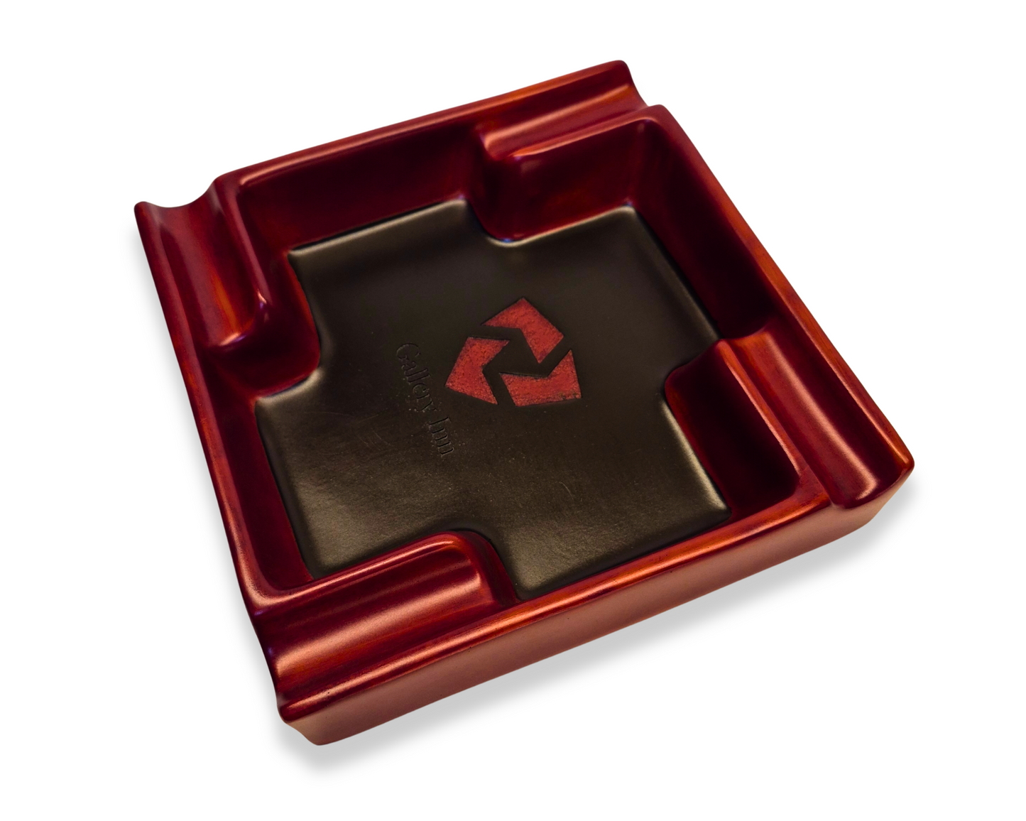 Red square ashtray with a logo on a white background