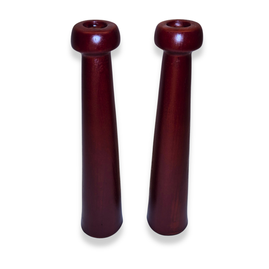 Two wooden candel holders on a white background