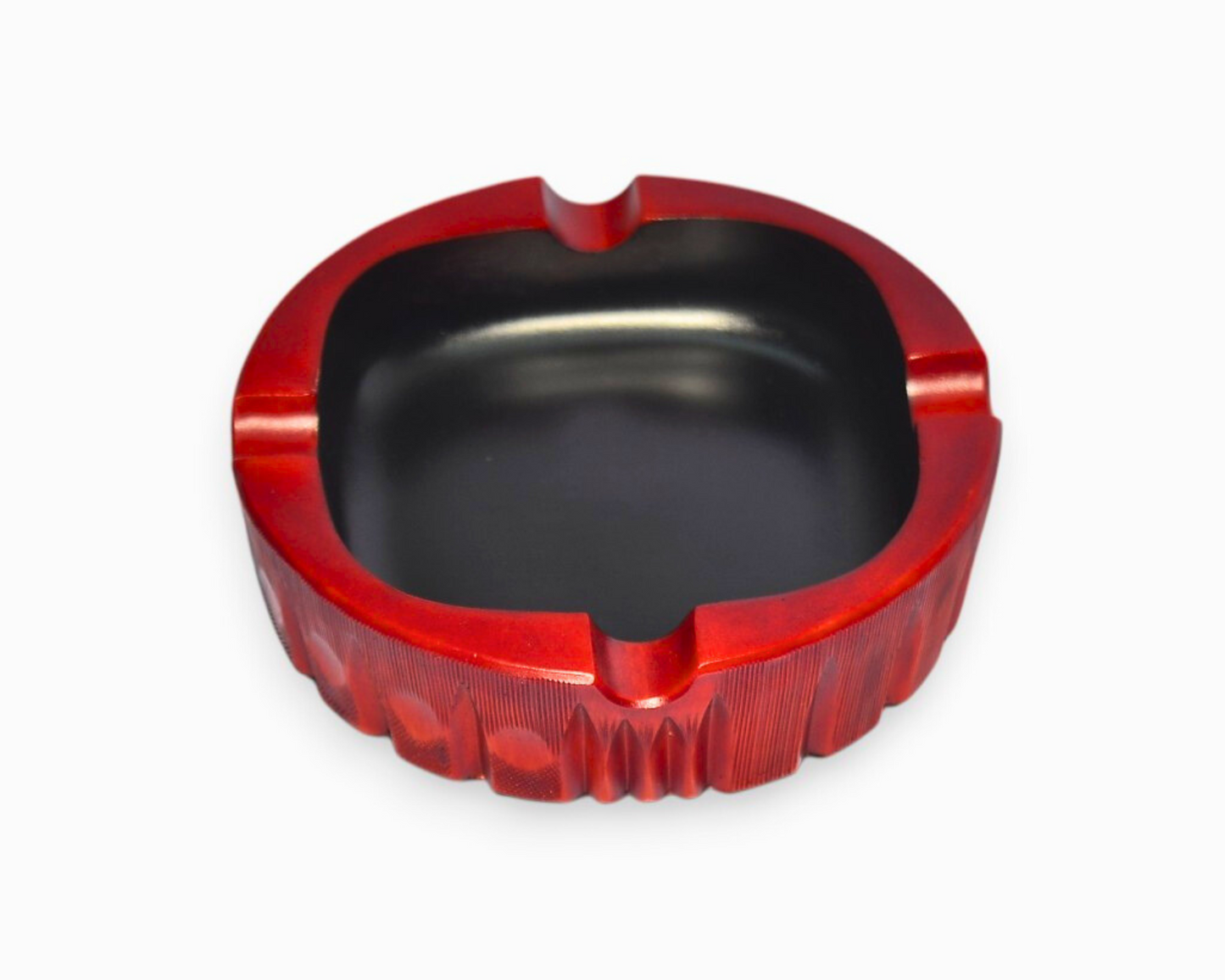 Red and black ashtray on a white background