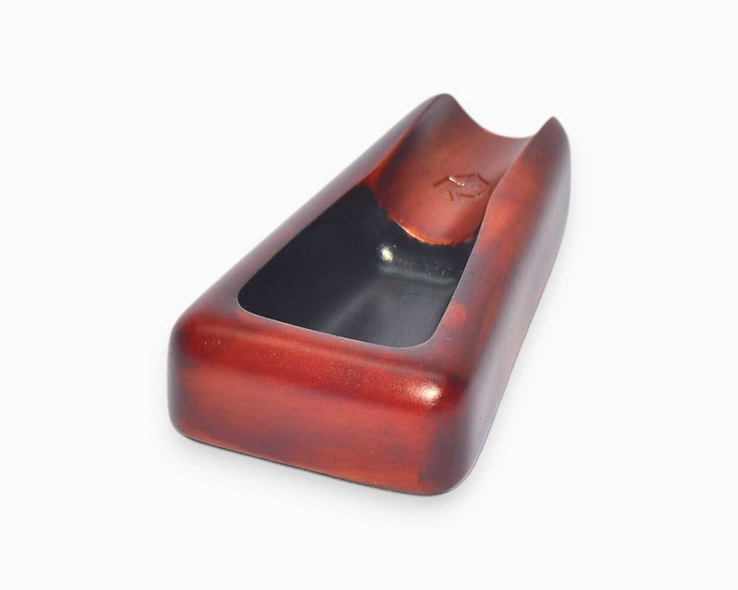 A small triangular cigar ashtray with a single cigar rest (brown)