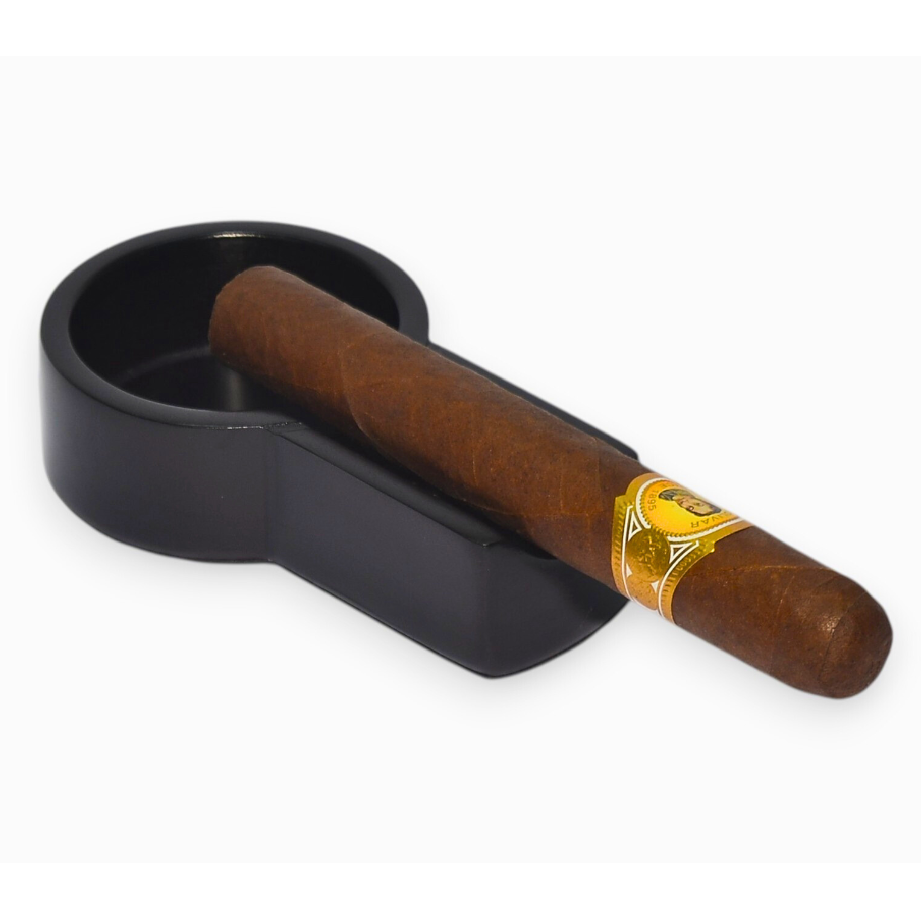 Cigar in a black holder on a white background