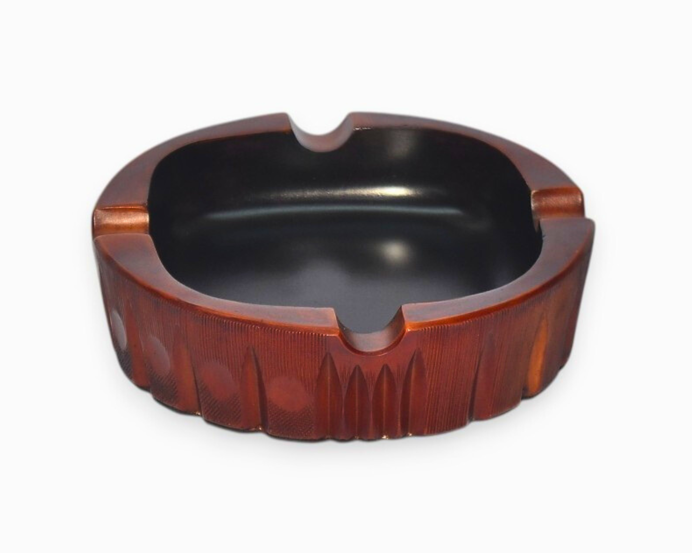 Wooden ashtray with a black interior on a white background