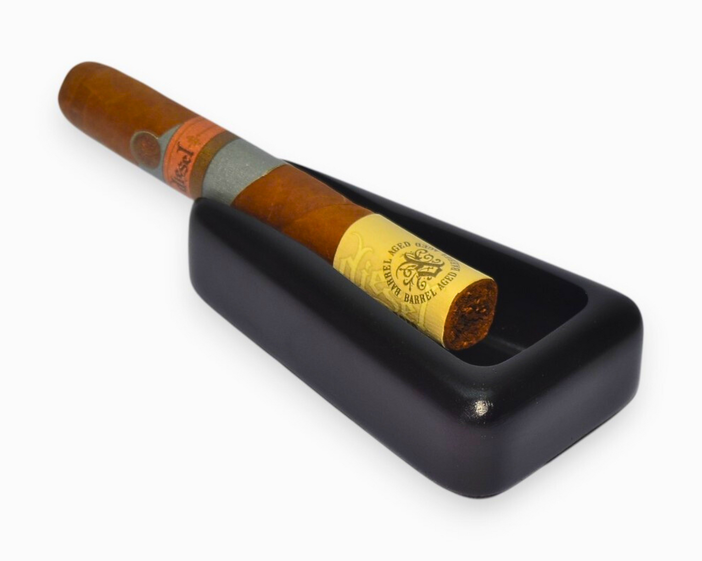 A small triangular cigar ashtray with a single cigar rest (black)