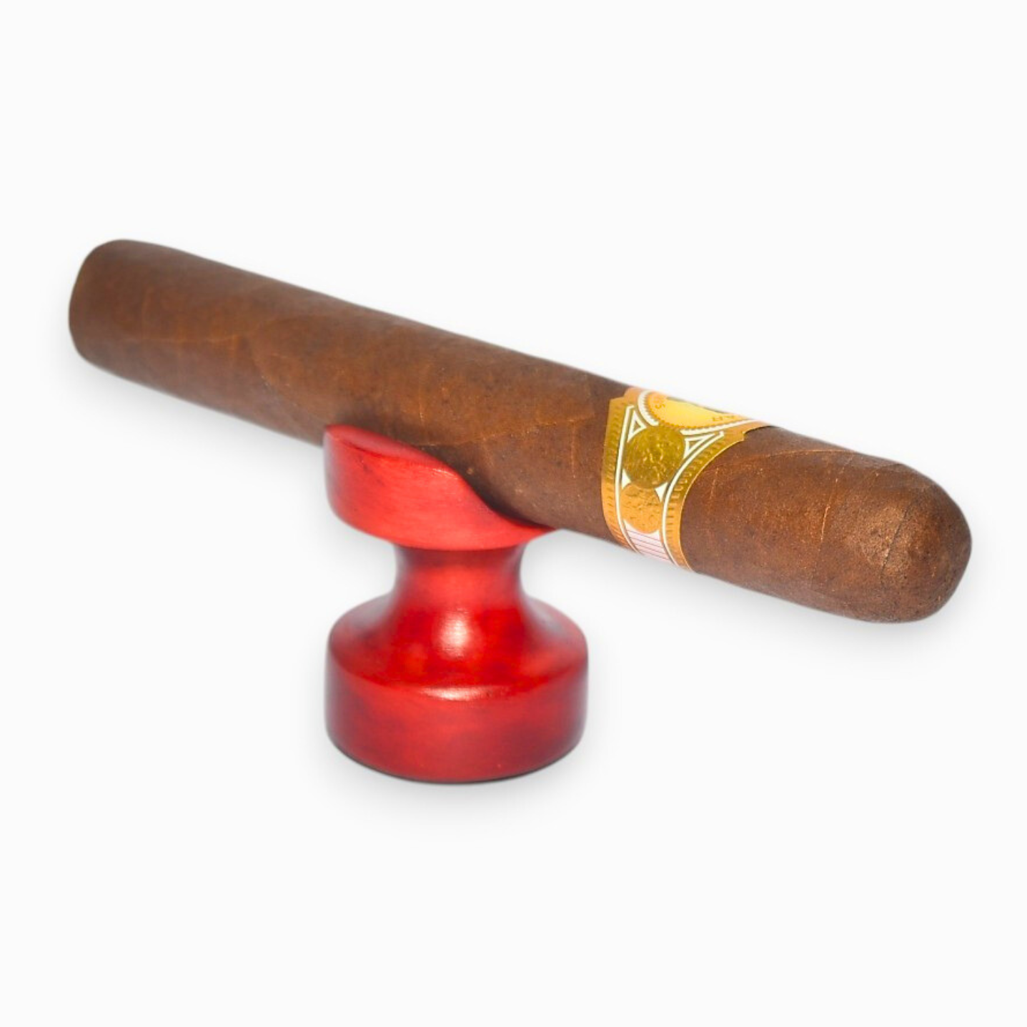 Cigar with a red holder on a white background
