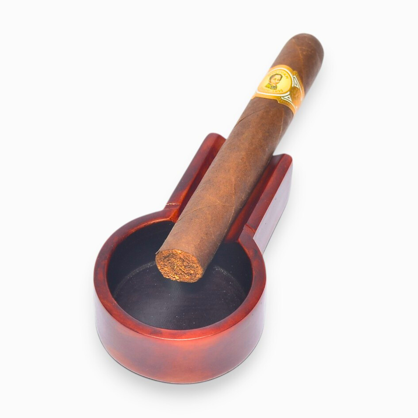Cigar in a wooden holder on a white background