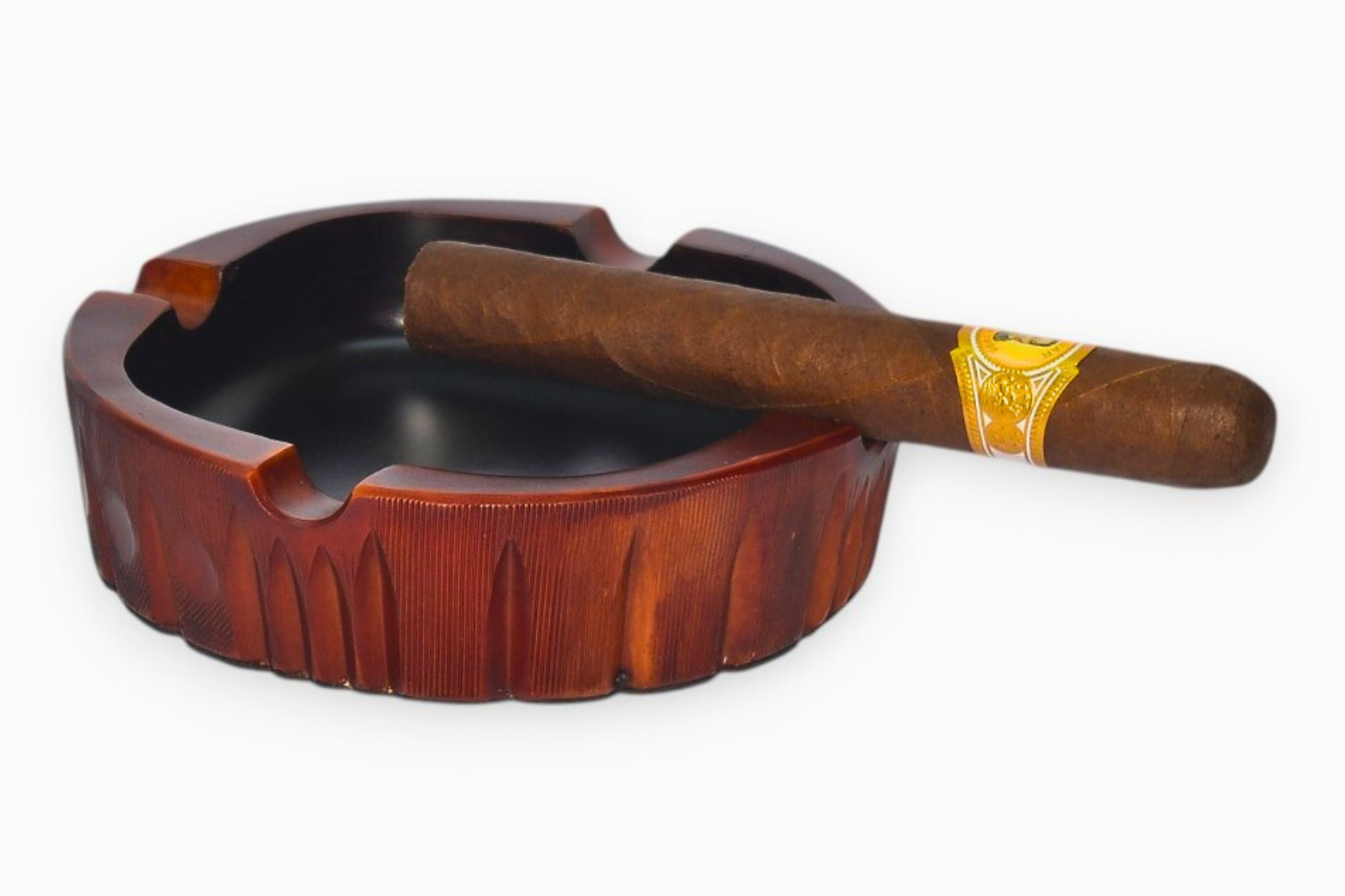 Wooden ashtray with a cigar on a white background
