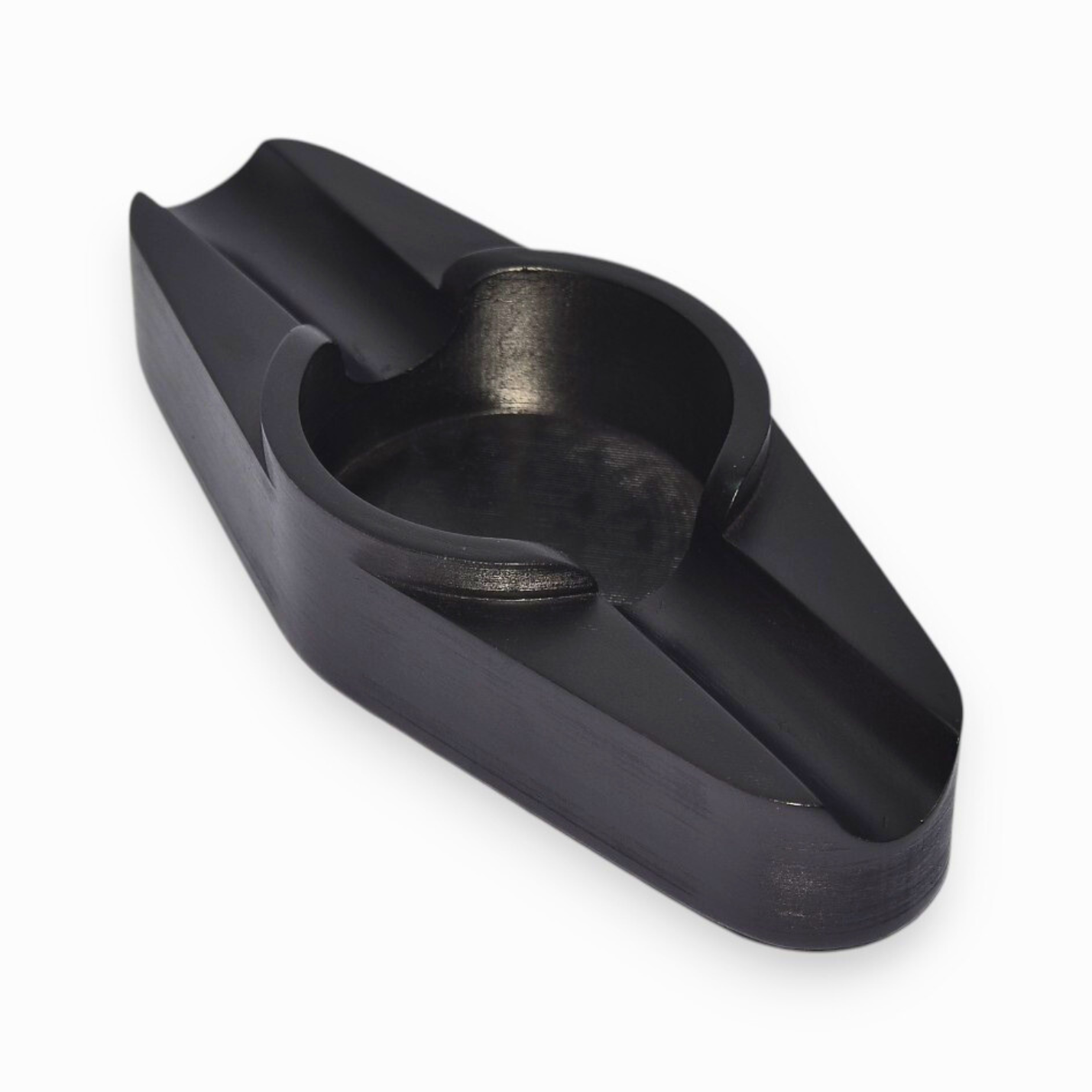 A cigar ashtray with two cigar rests and a round ash hole (black)