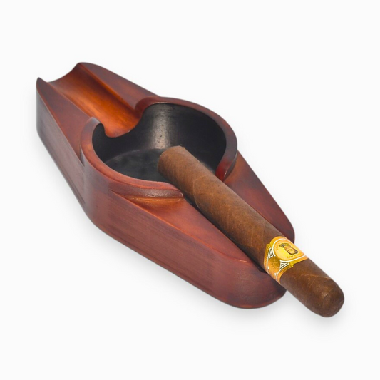 A cigar ashtray with two cigar rests and a round ash hole (brown)