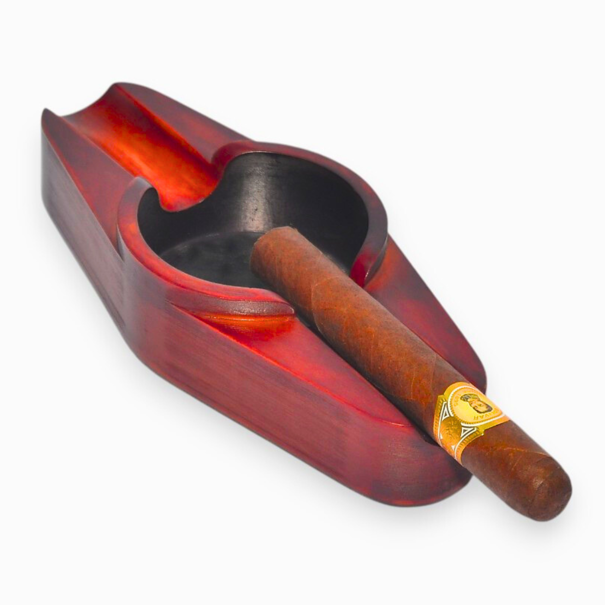 A cigar ashtray with two cigar rests and a round ash hole (mahogny)