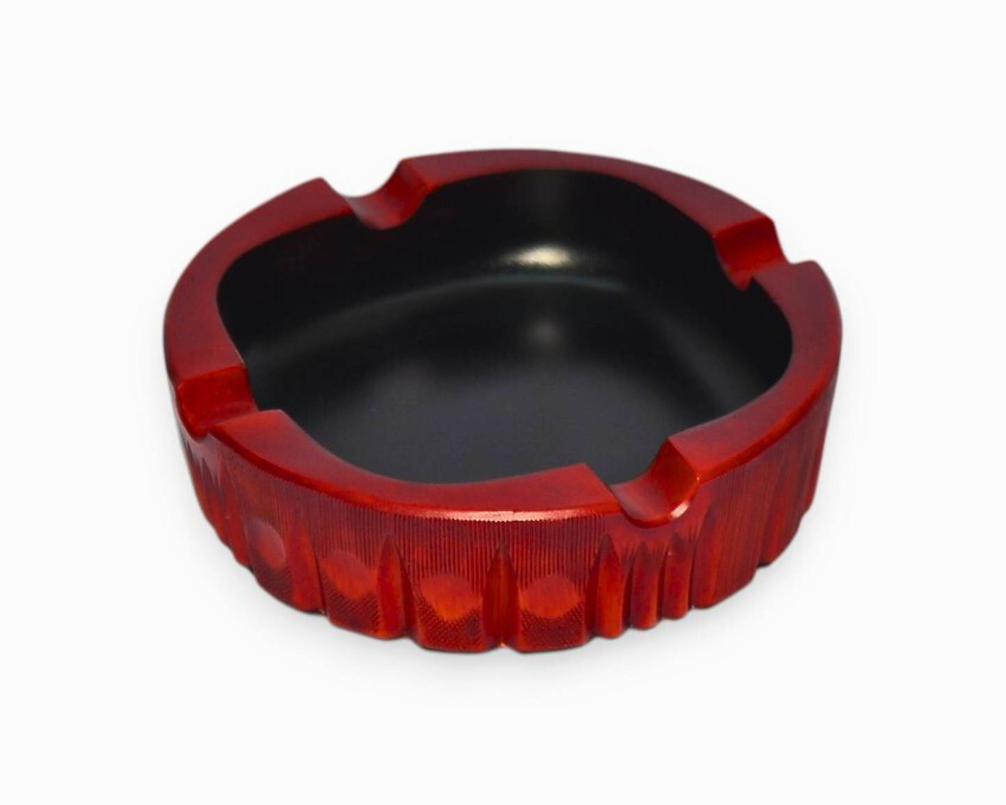 Red and black ashtray on a white background
