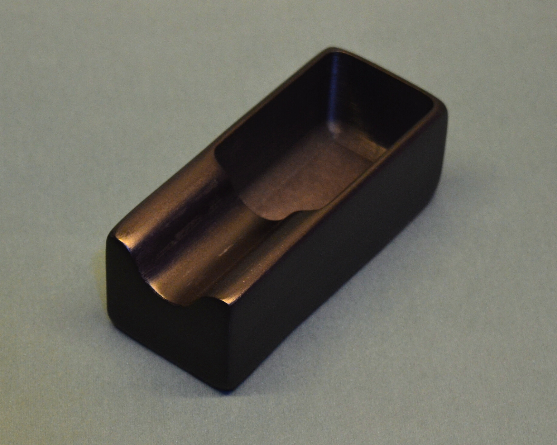 Black rectangular object on a gray background