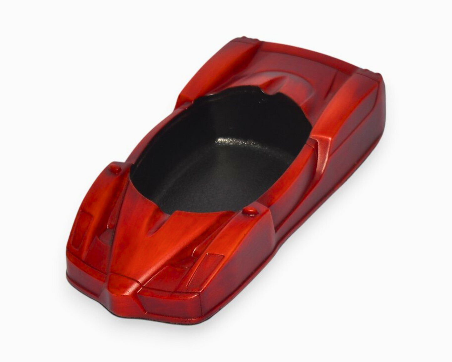Red and black car-shaped ashtray on a white background