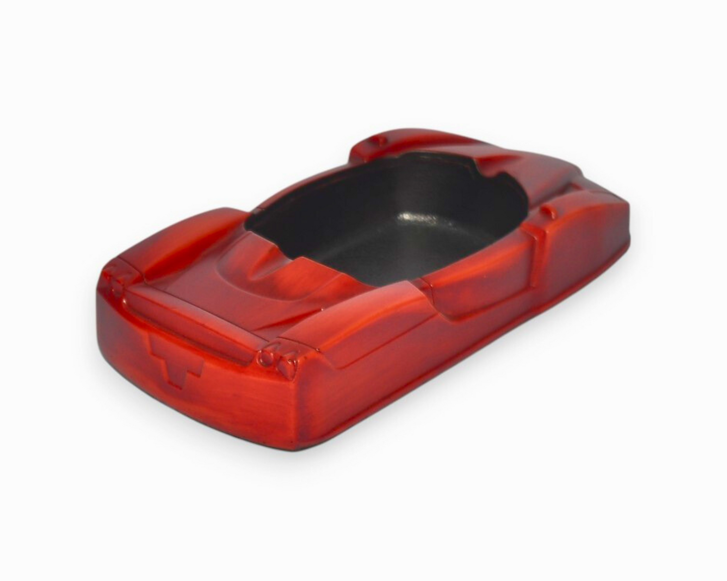 Red car-shaped ashtray on a white background