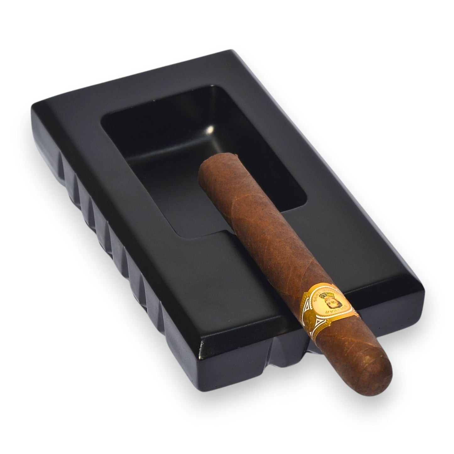 Black rectangular ashtray with a wooden cigar inside on a white background