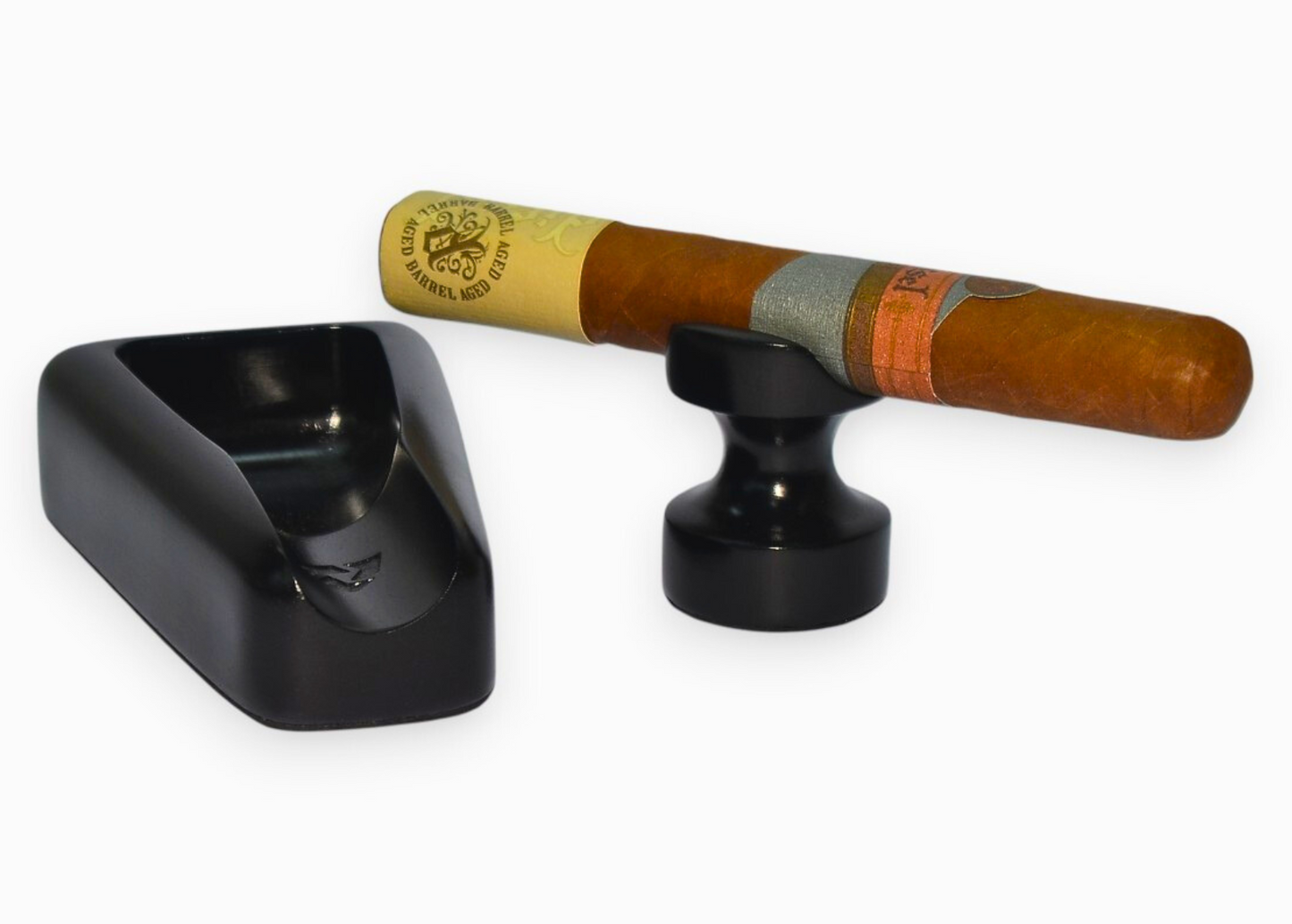 Cigar with a black ashtray on a white background