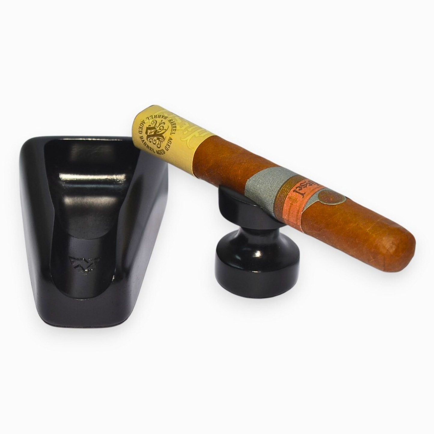 Cigar in a black holder on a white background