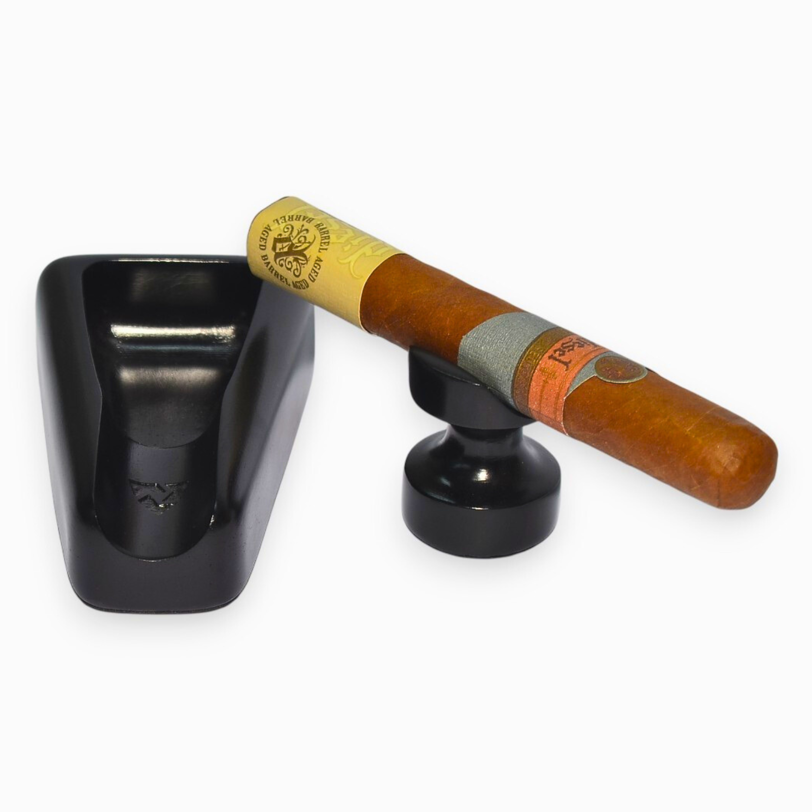 Cigar in a black holder on a white background