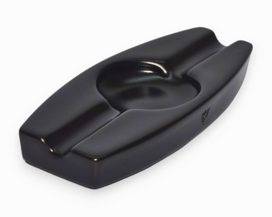 Black ceramic ashtray on a white background