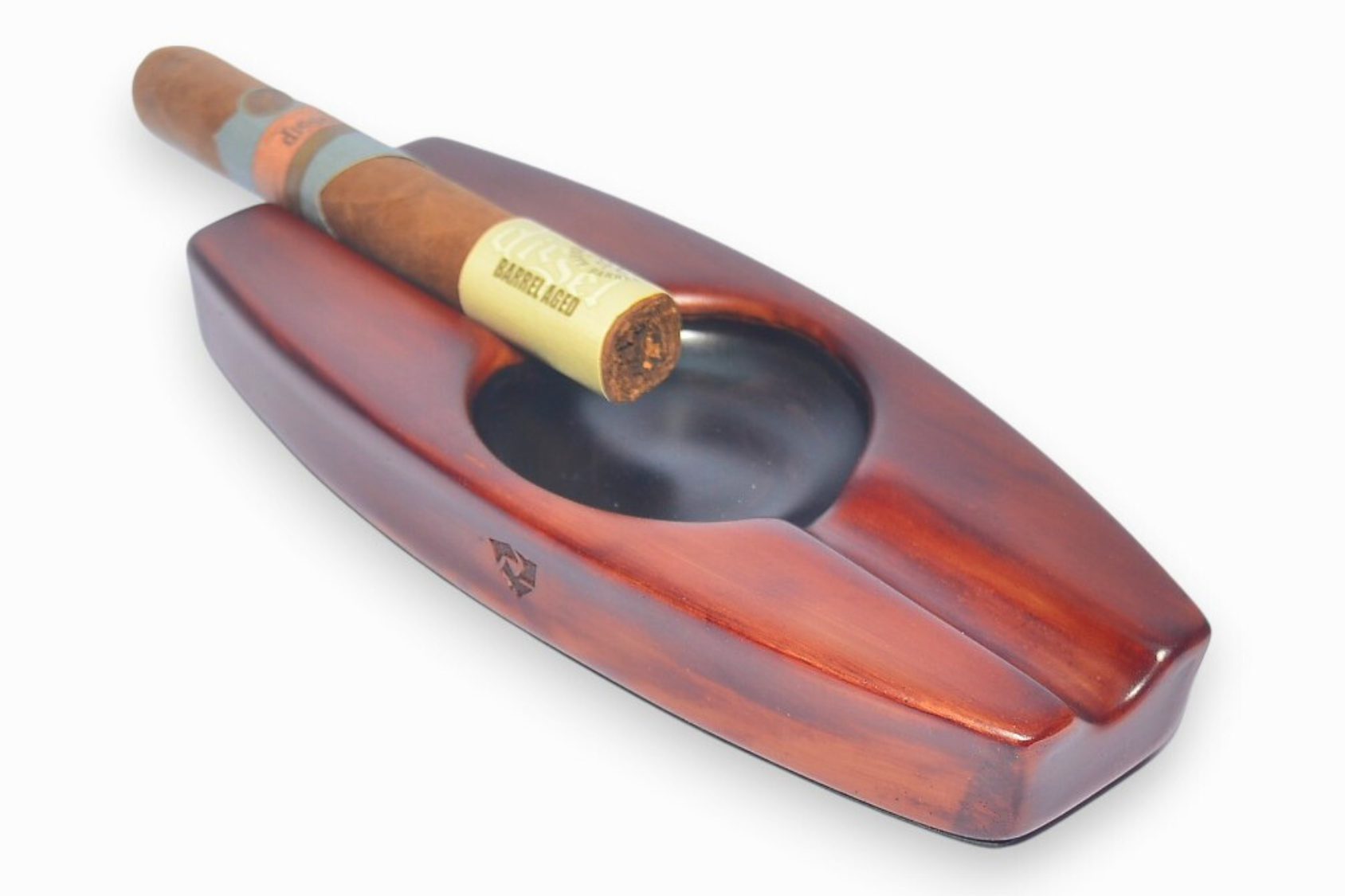 Wooden cigar ashtray with a single cigar on a white background