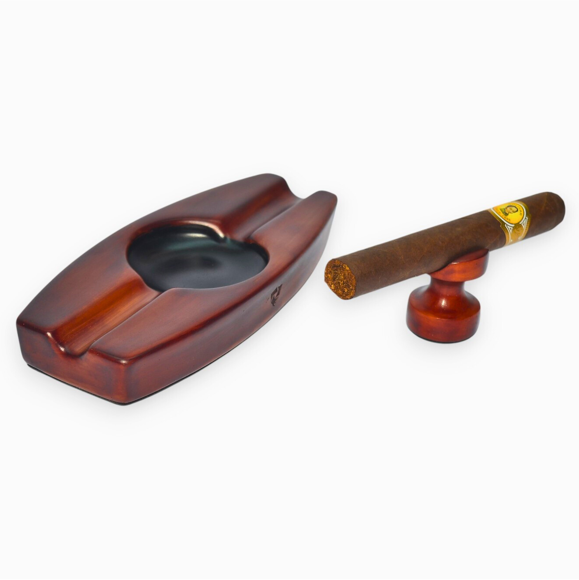 Wooden cigar ashtray with a cigar on a white background