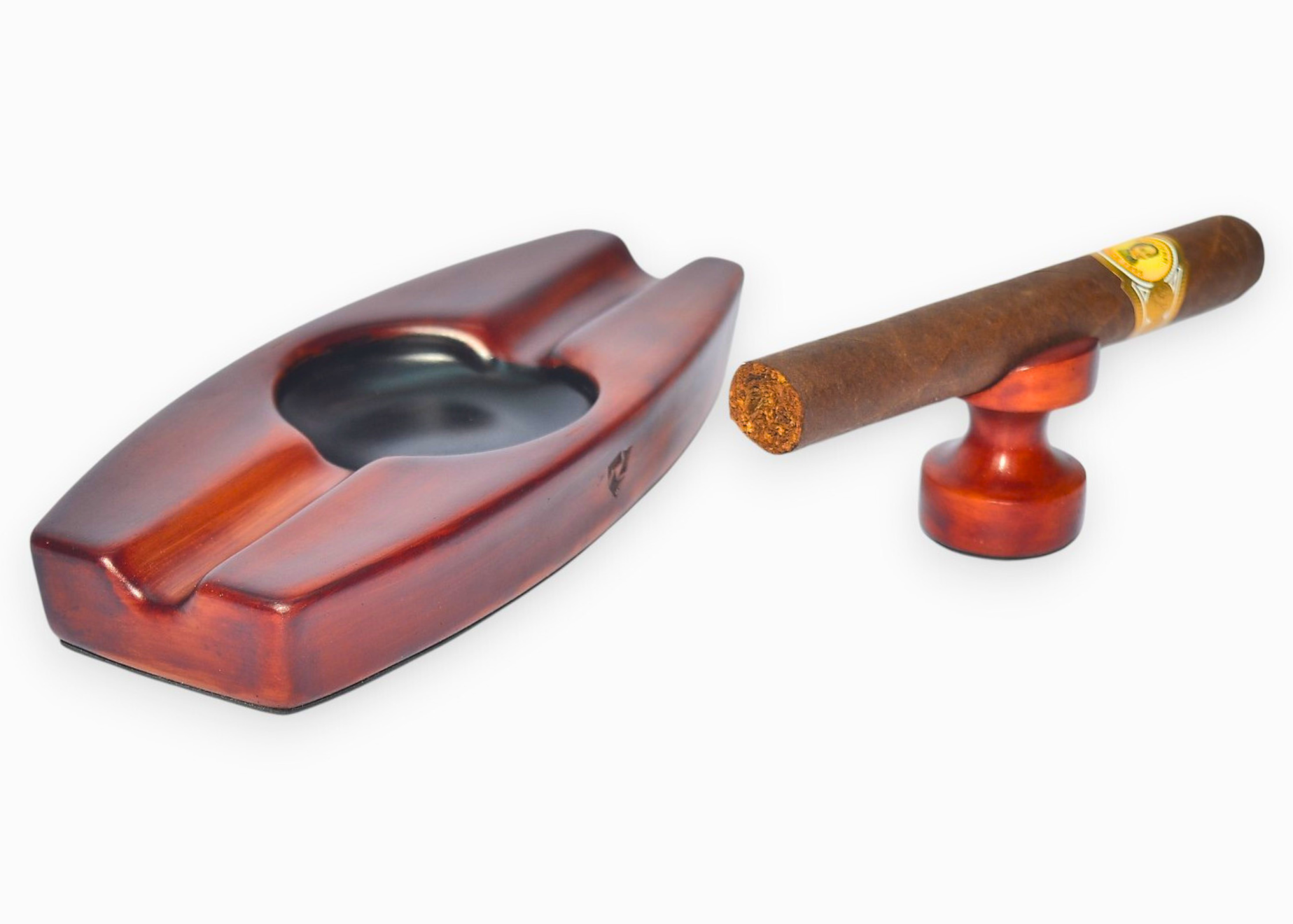 Cigar ashtray with a cigar on a white background