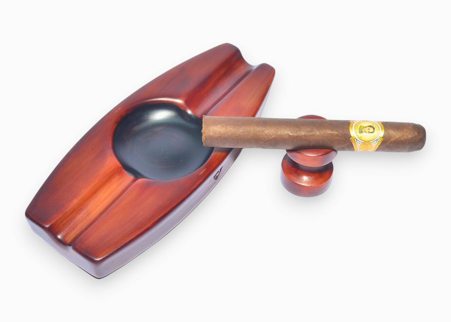 Wooden cigar ashtray with a cigar on a white background