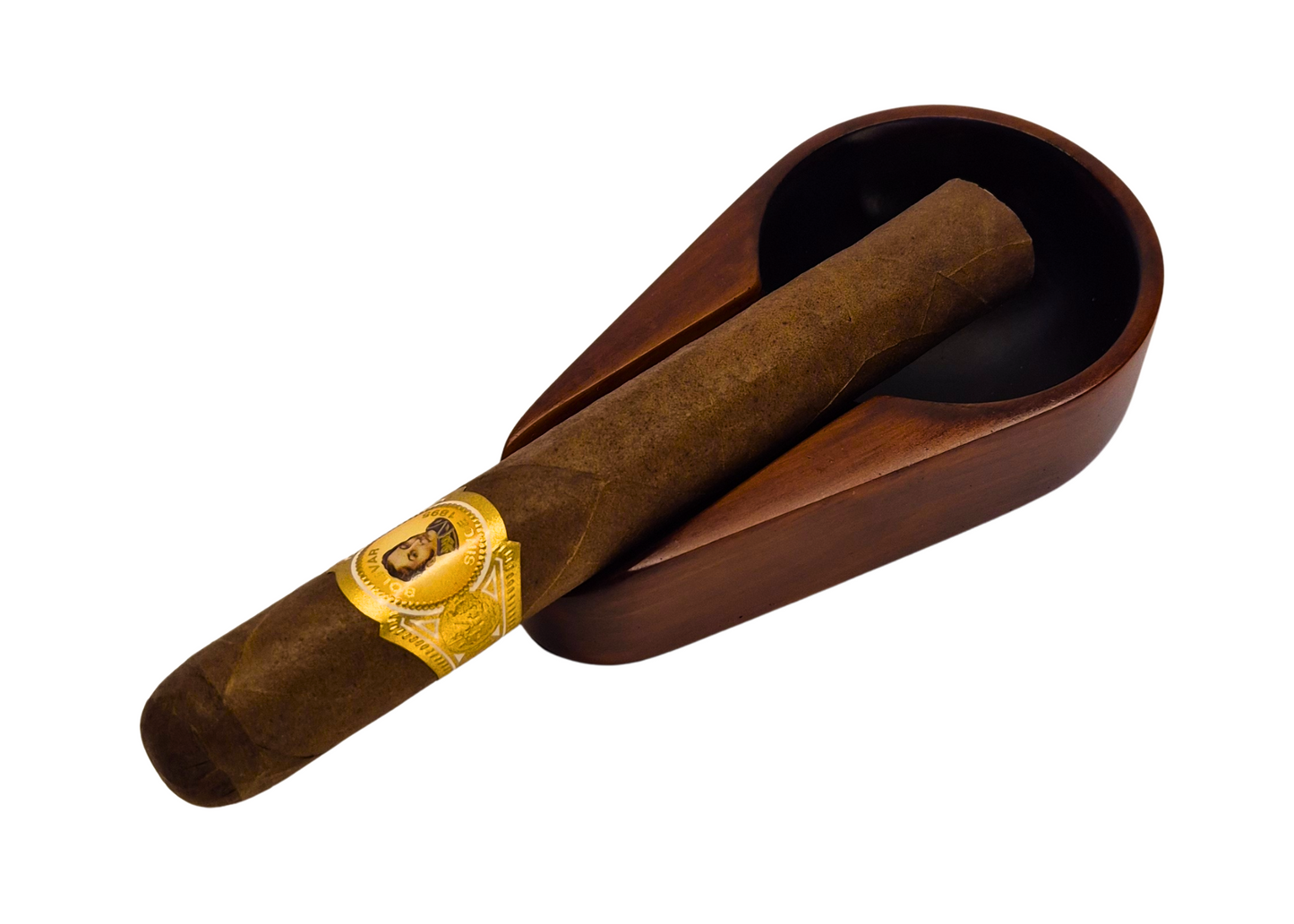 Cigar with gold band in a wooden holder on a white background
