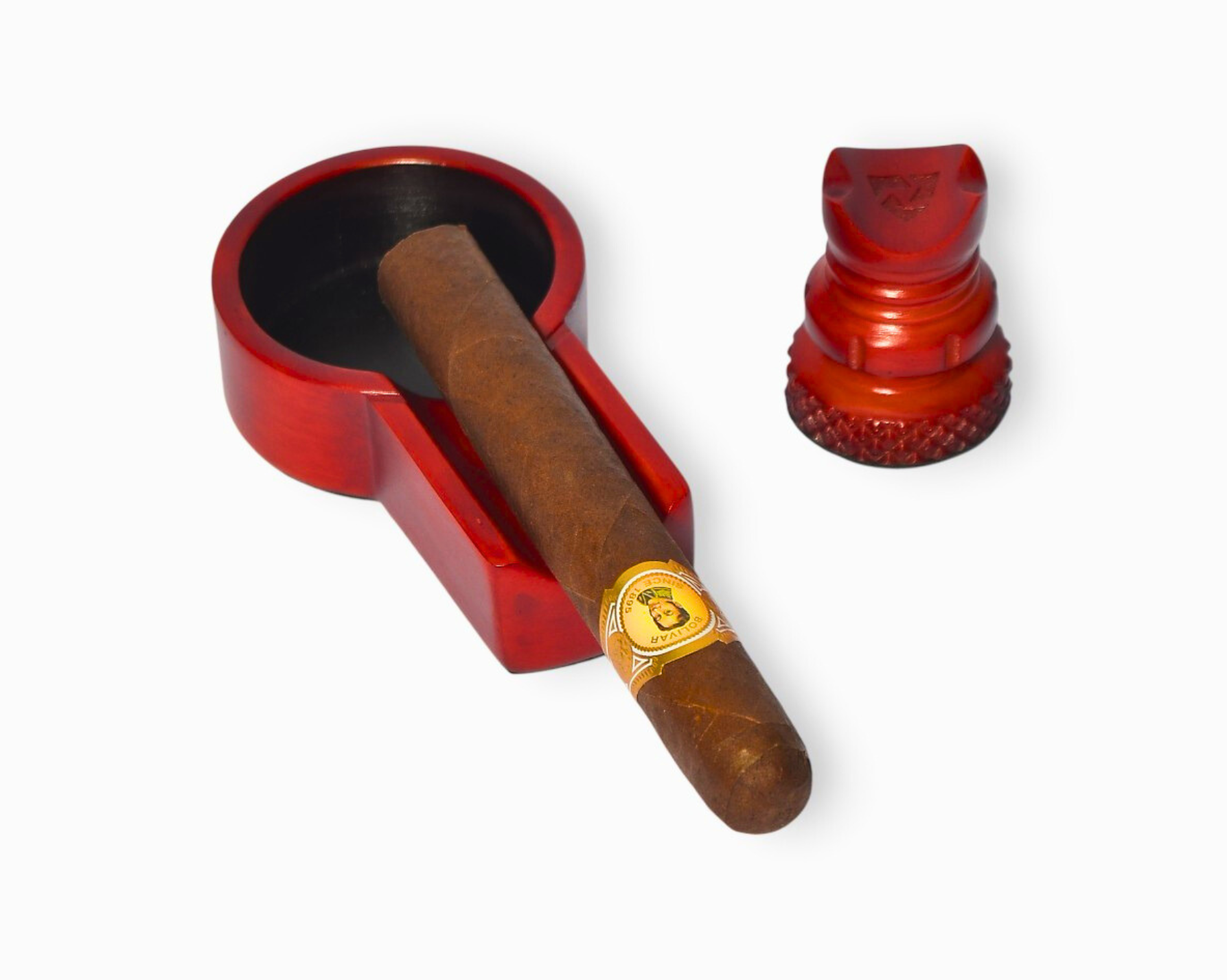 Cigar with a red holder and cutter on a white background