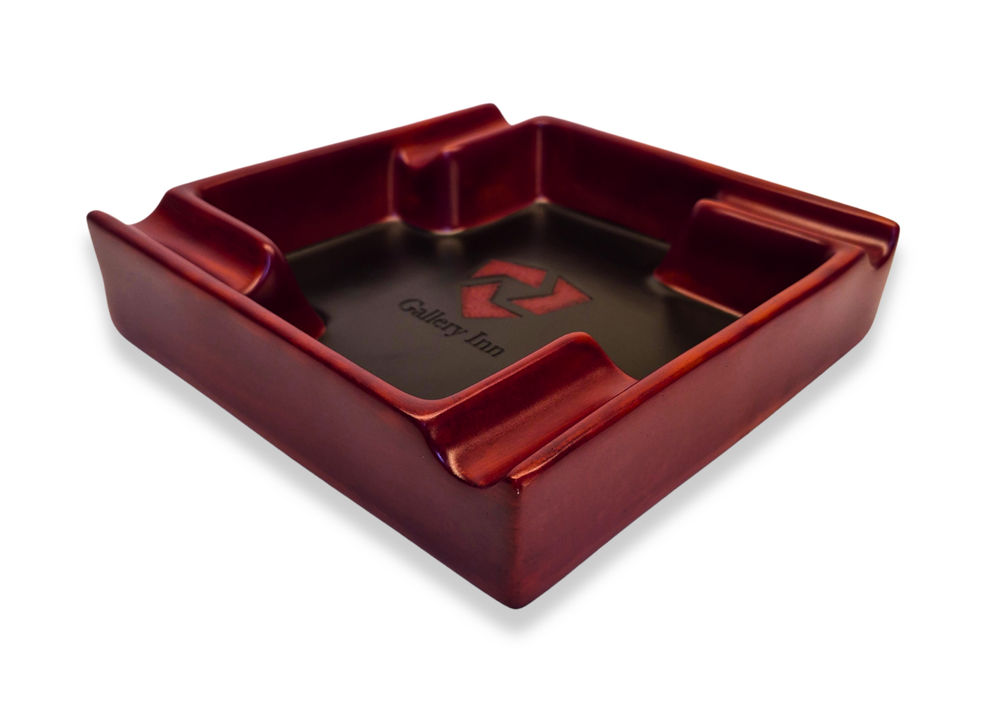 Red dice tray with a central black area and a logo on a white background