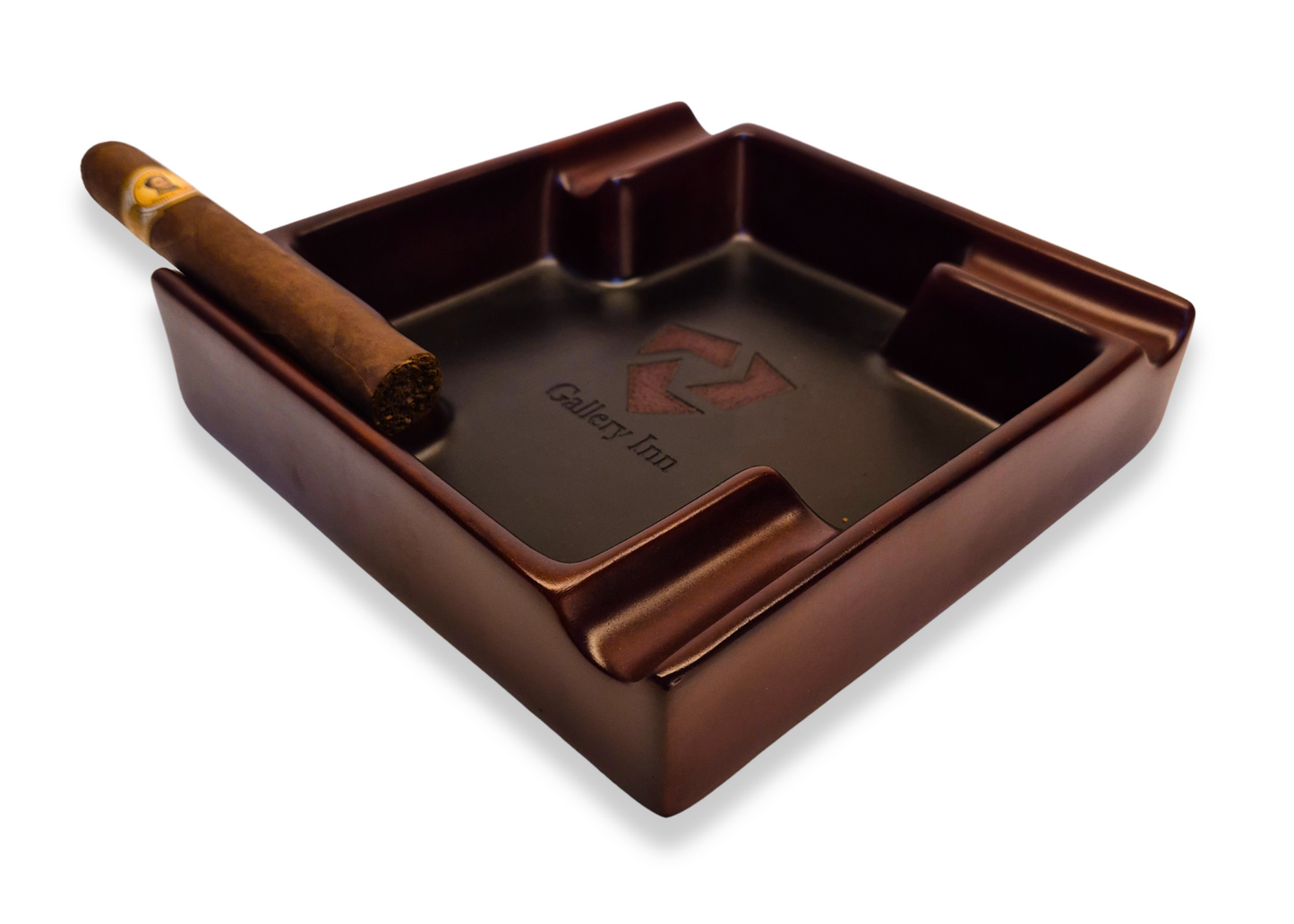 Brown cigar ashtray with a single cigar on a white background