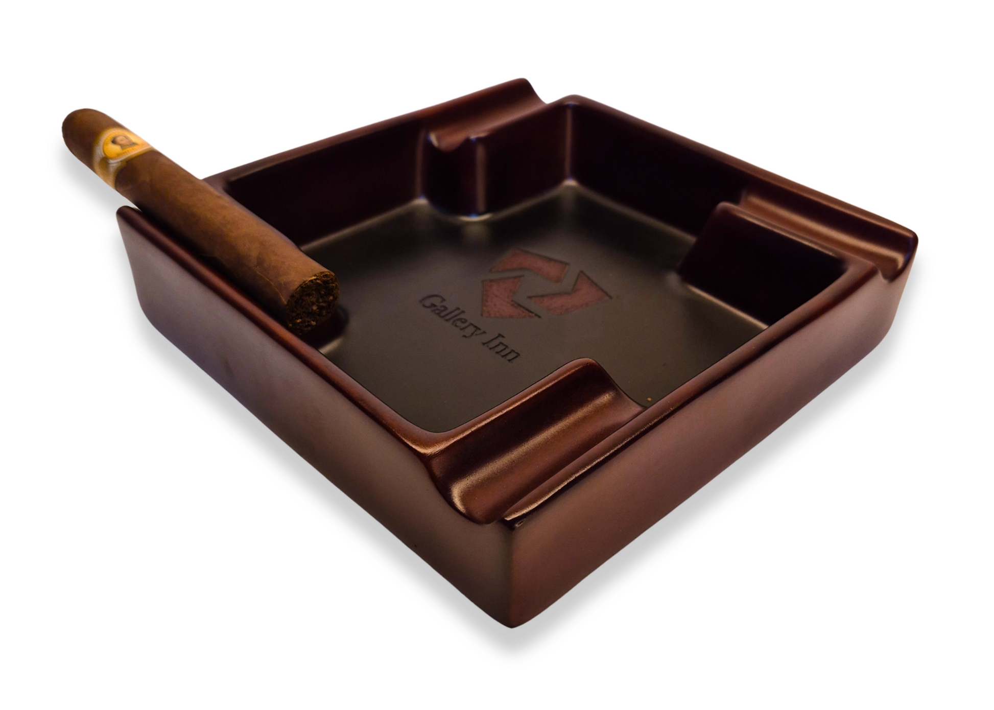 Brown cigar ashtray with a single cigar on a white background