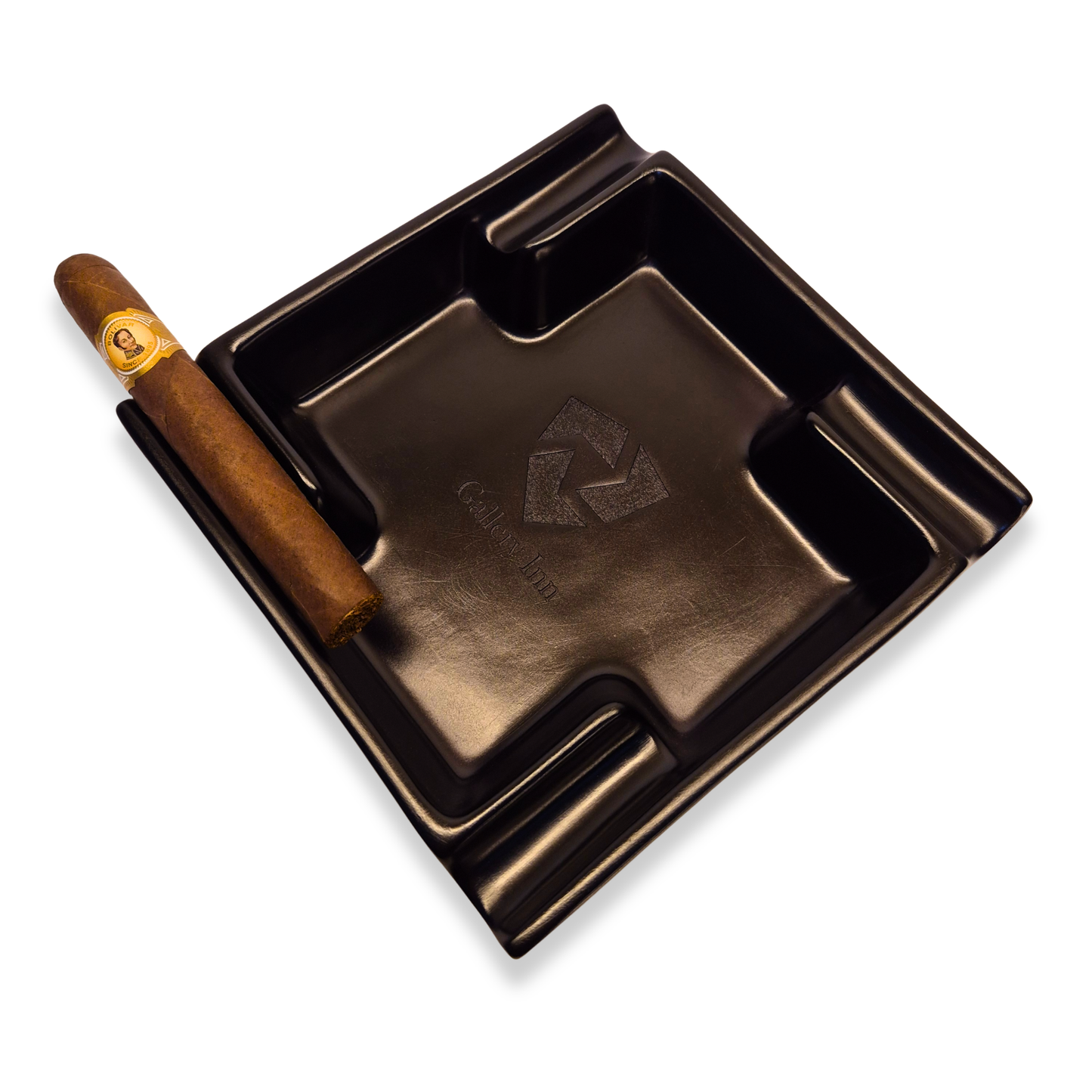 Cigar in a branded ashtray on a white background