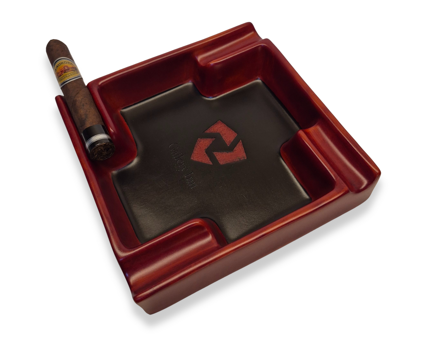 Red ashtray with a logo and a cigar on a white background