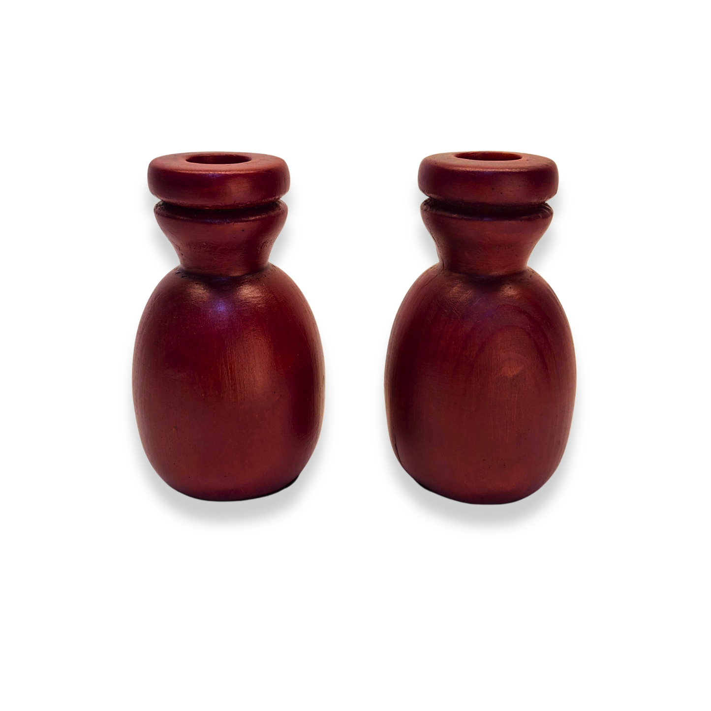 Two wooden candle holders on a white background