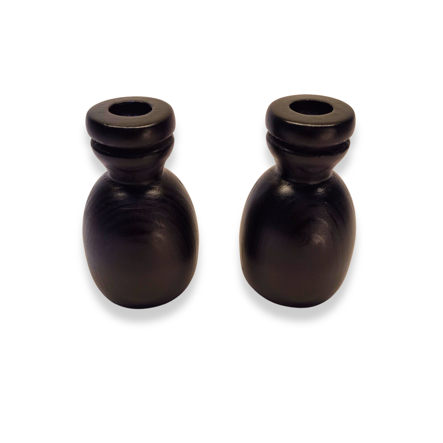 Two black candle holders on a white background