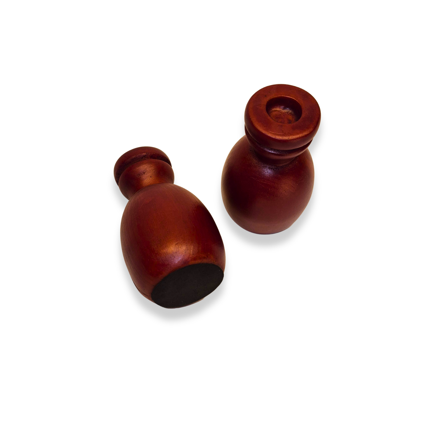 Two wooden salt and pepper shakers on a white background