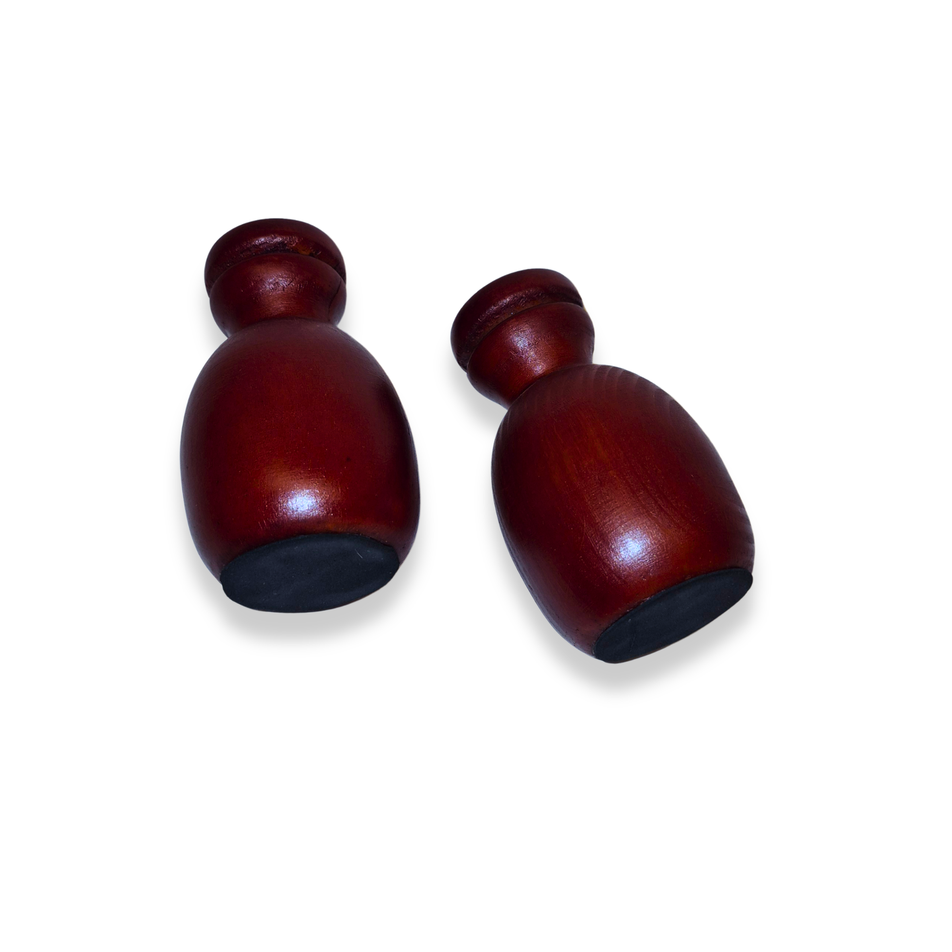 Two wooden maracas on a white background