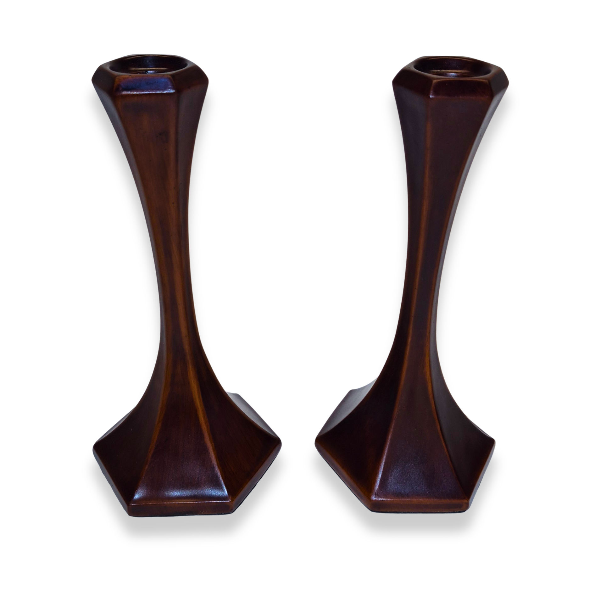 Pair of dark brown candle holders on a white background