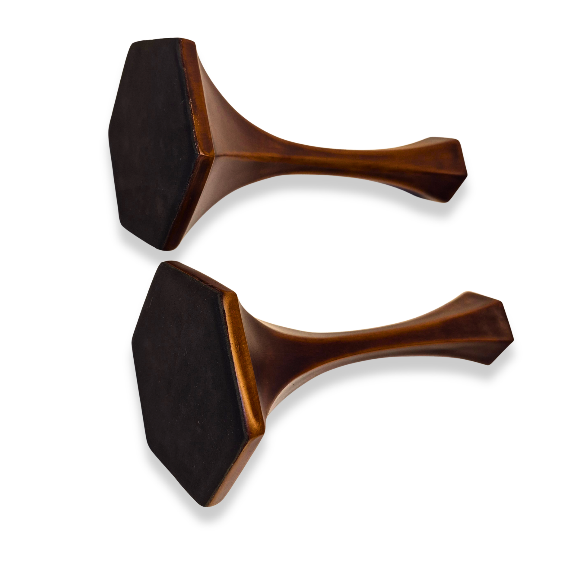 Two wooden spatulas with black heads on a white background