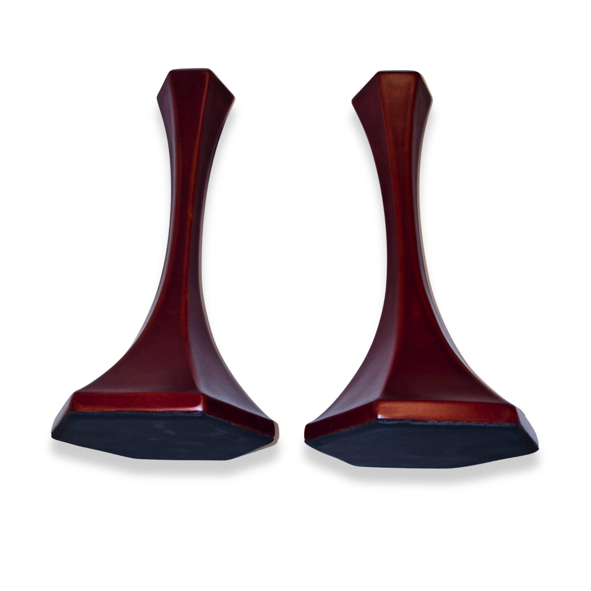 Two wooden candle holders on a white background