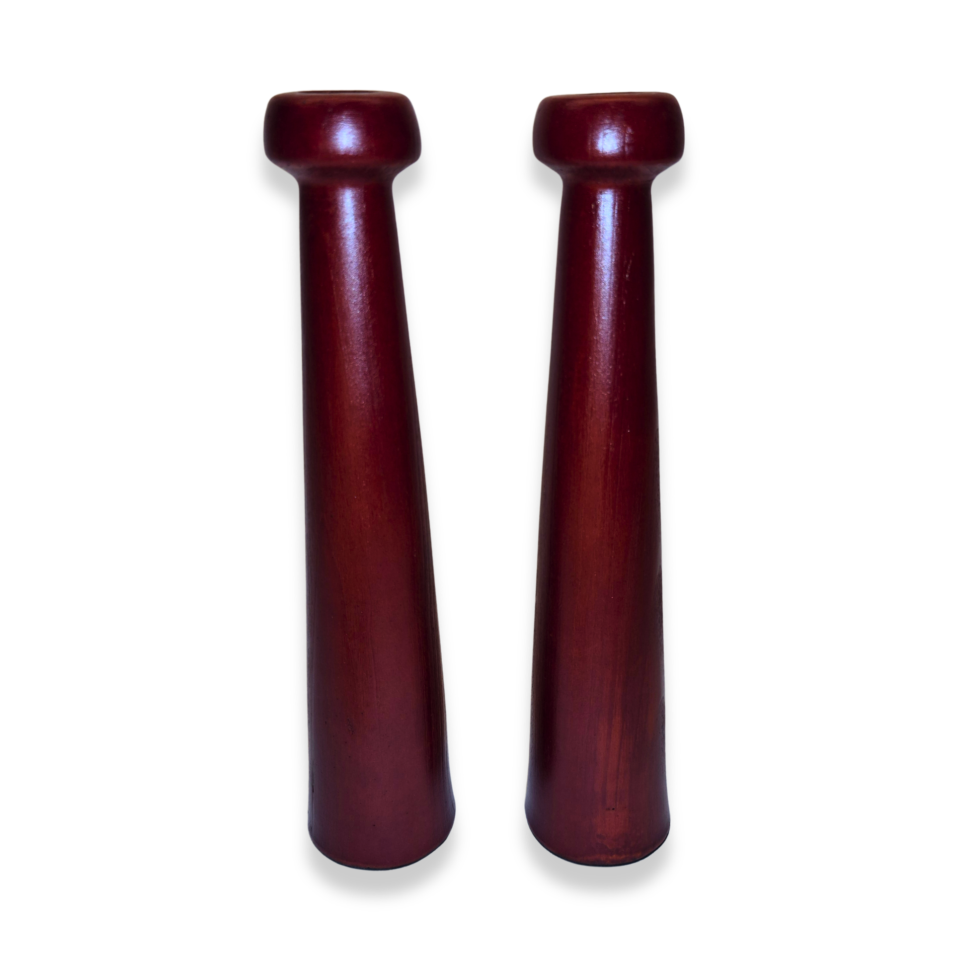 Two wooden candel holders on a white background