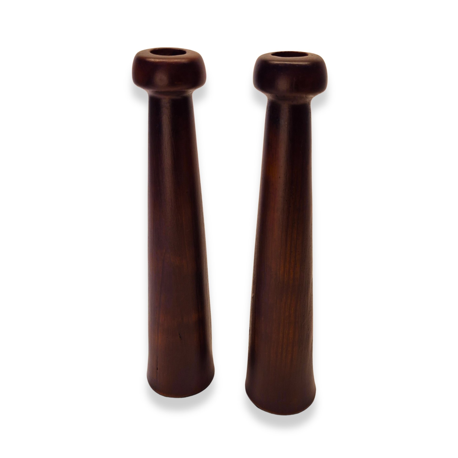 Two wooden handelsmills on a white background