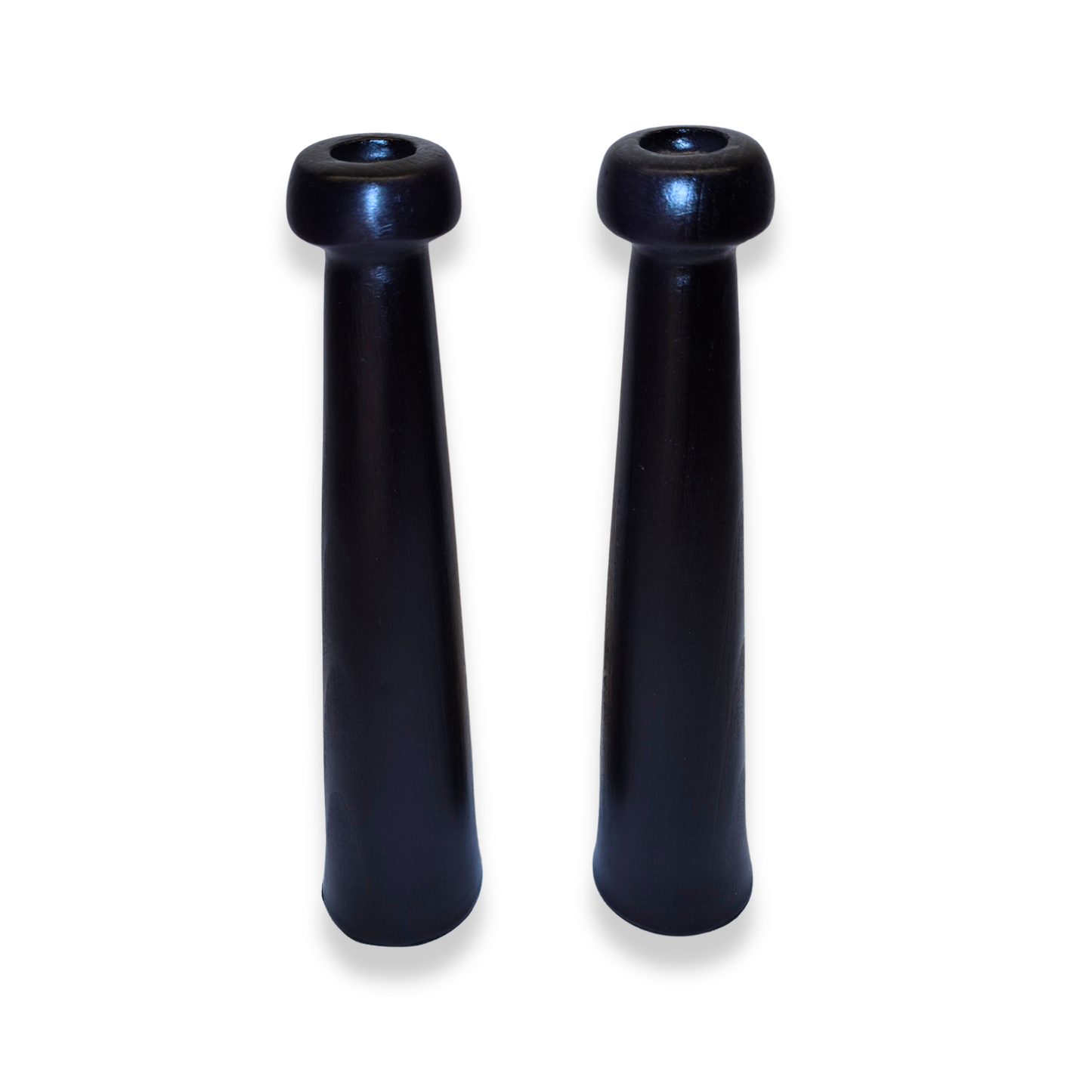 Two black cylindrical objects on a white background